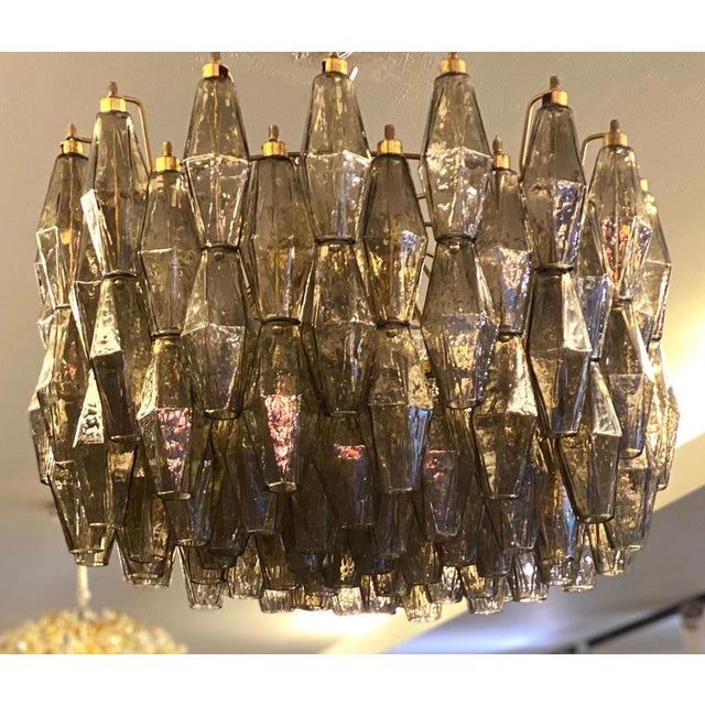 The chandelier consists of 103 hand blown grey "Poliedri" made of Murano glass. Edition limited from a great master of...