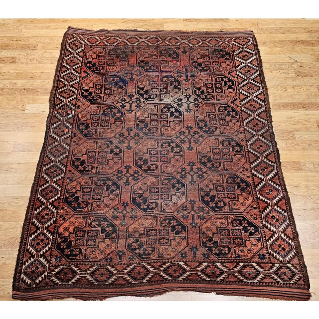 This early 20th-century Turkmen Ersari main carpet presents a bold and authentic tribal design in an allover Gul...