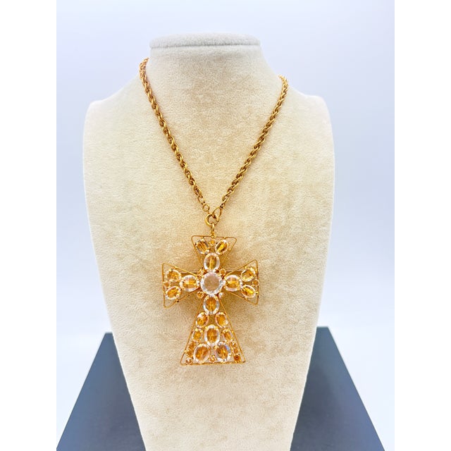 Signed Schreiner New York cross pendant-brooch necklace with original 48-inch gold-tone chain. Entirely handmade, this...