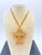 Signed Schreiner New York cross pendant-brooch necklace with original 48-inch gold-tone chain. Entirely handmade, this...