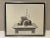 Modern print of various articles placed on a table. Signed illegibly and framed