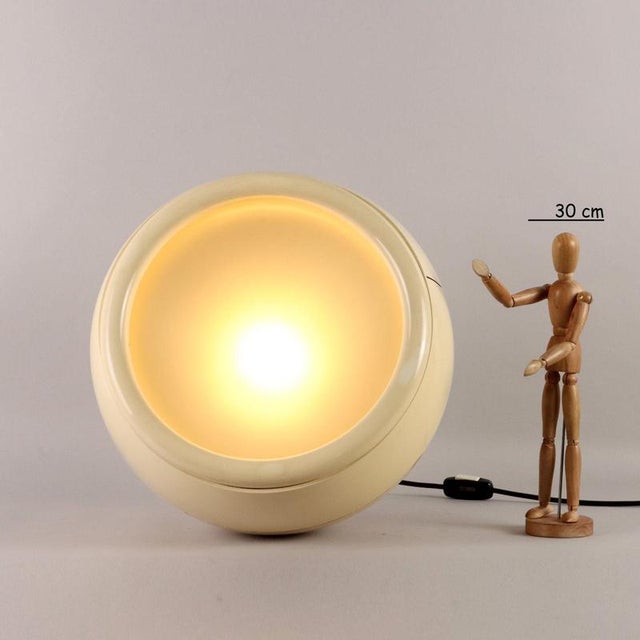 Floor/table lamp, ABS plastic and glass material. This piece is attributed to the mentioned designer/maker. It has no...