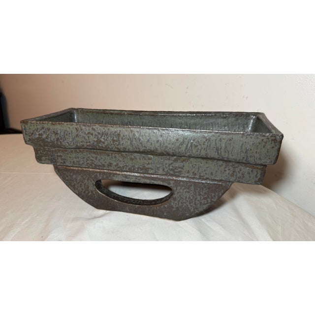 This vintage mid-century modern handmade green studio pottery planter vase is a unique and stylish addition to any home...