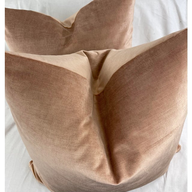 Custom pair of 22" pillows covered in a soft velvet in a pale sienna color. This velvet has a slight sheen. These pillows...