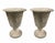A compelling pair of mid-to-late 20th-century brutalist-style urns, masterfully crafted from cast stone with a heavy,...