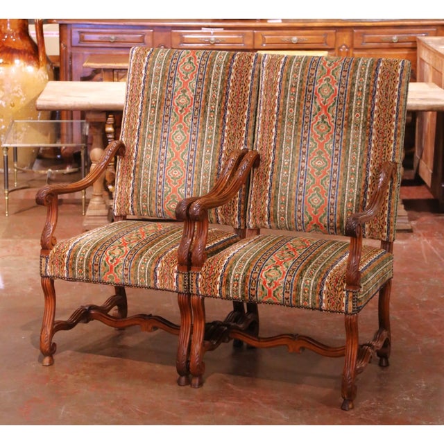 Place this elegant pair of antique armchairs in a study, library, or living room for comfortable seating with strong...