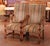Place this elegant pair of antique armchairs in a study, library, or living room for comfortable seating with strong...