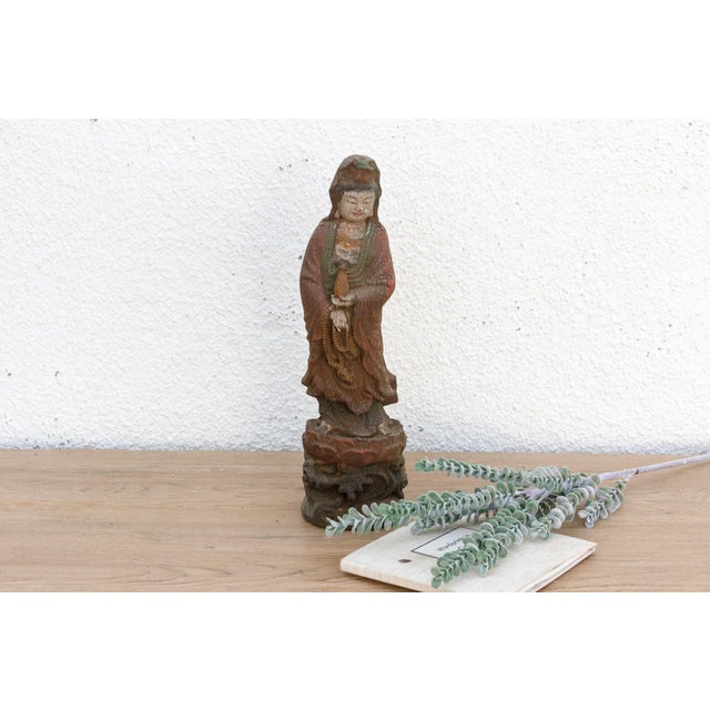 Discover the serene beauty of a peaceful, contemplative moment captured in wood with this charming petite carved and...
