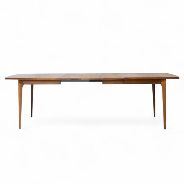 Broyhill Brasilia Mid Century Expanding Walnut Dining Table with 3 Leaves This table measures: 66 wide x 40 deep x 30...