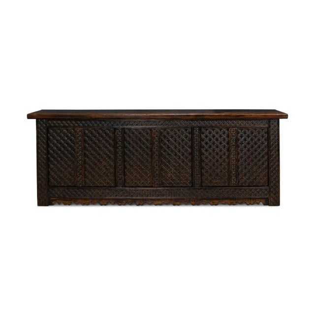 Crafted from carved reclaimed pine, featuring a distressed, hand-rubbed, and antiqued brown finish. Six cabinet doors open...