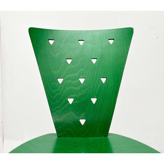 Postmodern chair from Italy in a unique color. The shells are made of green-stained molded plywood. The backrest features...