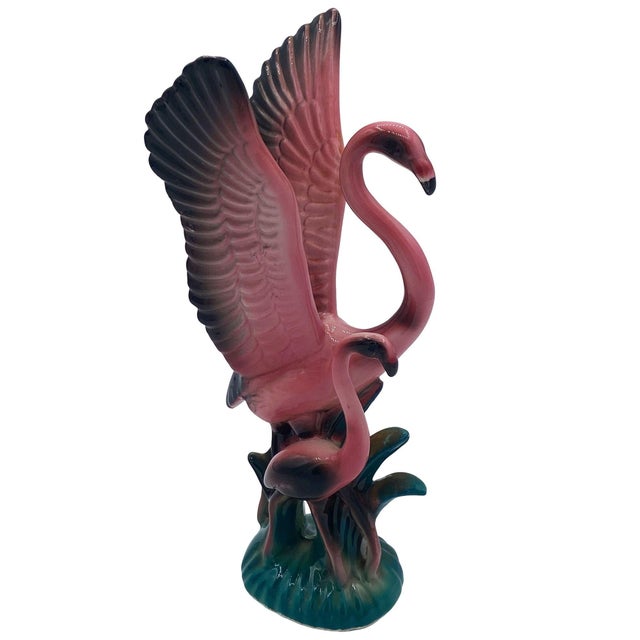 Mid-century pink and green ceramic open-wing mother flamingo tabletop pottery statue by Leftons. The statue features a...