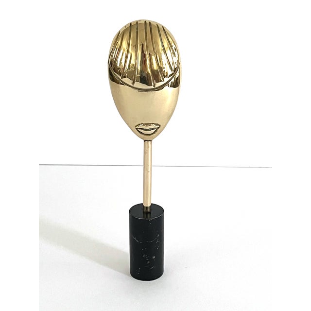 Fabulous vintage brass sculpture of an abstract face mounted to a base. Vintage 70's, possibly 80's, this is a fun and...