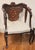 This French Style Antique Mahogany Armchair is a fully assembled piece with a rich brown color and intricate mother of...