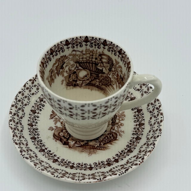 A beautifully coordinated vintage English cup and saucer by Empire (England) in the Beverley pattern, featuring warm brown...