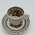 A beautifully coordinated vintage English cup and saucer by Empire (England) in the Beverley pattern, featuring warm brown...