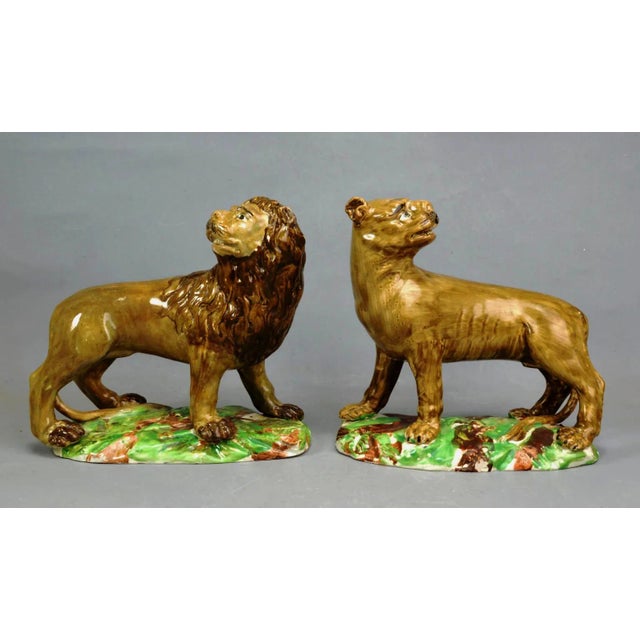 Regal Guardians: Ralph Wood Type Pearlware Lions: A True Pair: 18th Century Pearlware Lion and Lioness This magnificent,...