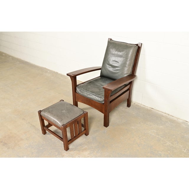 An exceptional Mission or Arts & Crafts bow arm lounge chair with ottoman By L. & J.G. Stickley USA, Circa Late 20th...