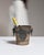 This early 20th century ice bucket from France is finished in silver. It is fitted with an ornate cast medallion crest, a...