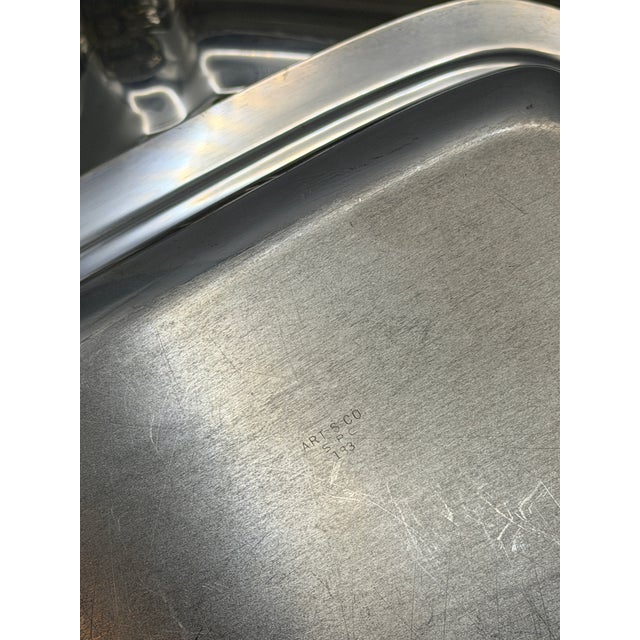 This vintage Art & Co. silverplate covered serving dish exemplifies classic American tableware design, combining graceful...