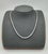 A modern platinum necklace adorned with 11.21 carats of natural round-cut white diamonds, exhibiting a clarity of VS2/SI1...