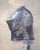 The artwork presents a striking depiction of a two-piece helmet from the Chalcis group, rendered in oil on panel. The...