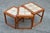 A great vintage set of 3 Danish Modern nesting tables in teak with inlaid tile tops. This matched nest of 3 solid wood...