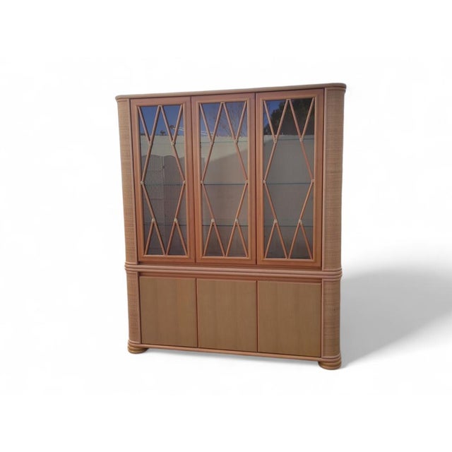 This imposing Roberti Rattan sideboard is a masterpiece of Italian craftsmanship, blending the warmth of natural fibers...