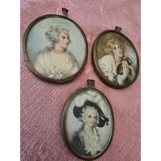 A rare set of three collection of handpainted miniature paintings in their original frames ( guaranteed all handpainted...