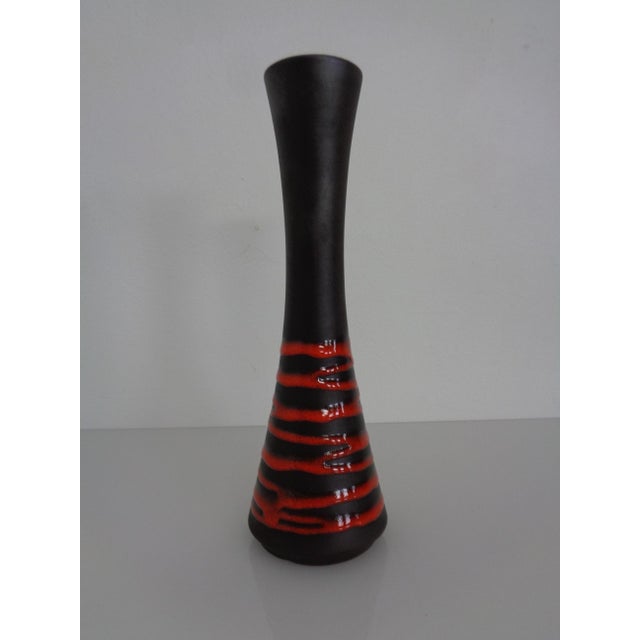 Black and red ceramic vase by Steuler Keramik from the 1950s. Marked with a label and under the base. This piece has an...