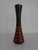 Black and red ceramic vase by Steuler Keramik from the 1950s. Marked with a label and under the base. This piece has an...