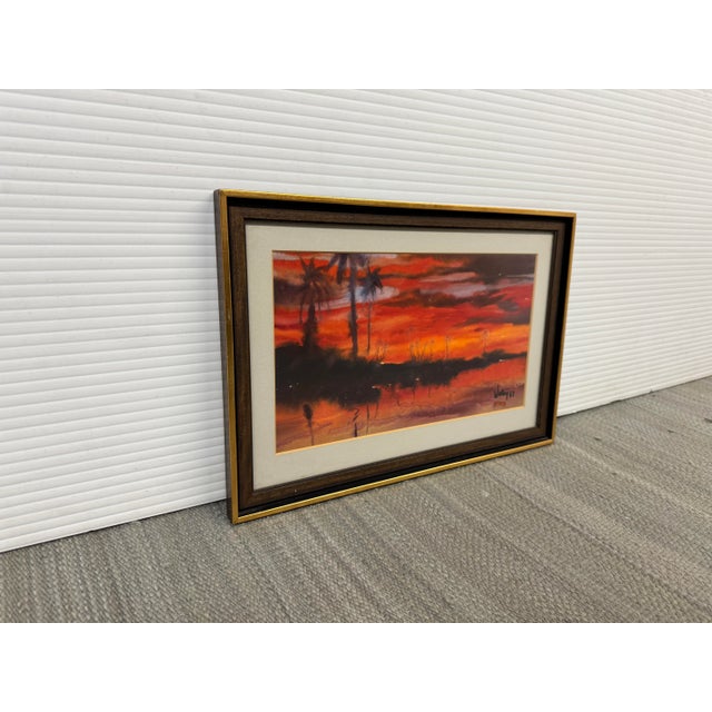 Design Plus Gallery presents a Vibrant Watercolor Painting by J. Chang. The artwork has an incredible sunset with intense...