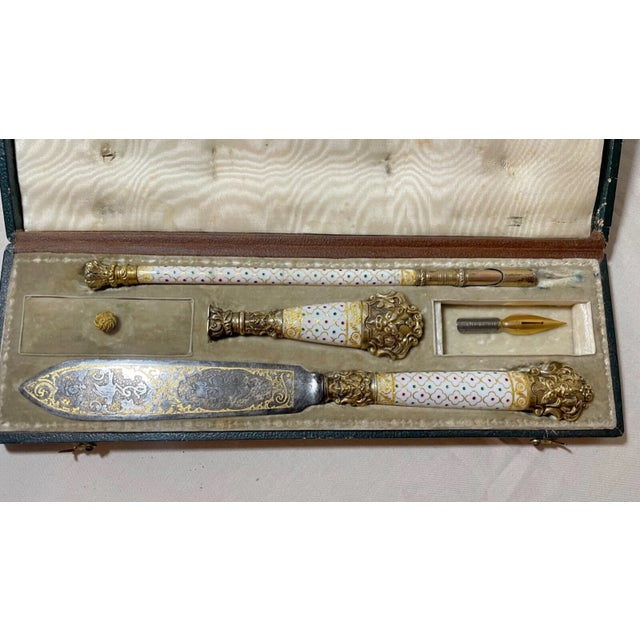 This exquisite writing set is a true early Victorian gem. Crafted from high-quality sterling silver gilt and adorned with...