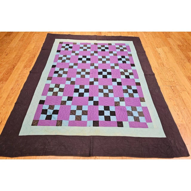 Beautifully hand-crafted American Amish pieced cotton quilt in a “Nine Patch” pattern from Lancaster County, Pennsylvania...