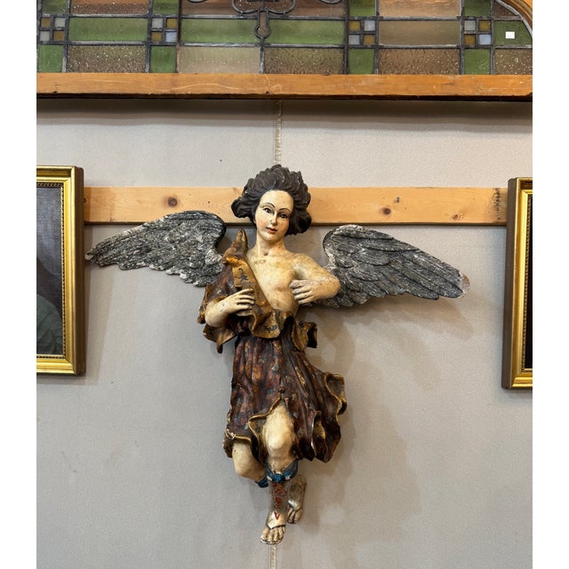 Charming late 19th-century Italian angel sculpture, hand-carved in wood and retaining its original polychrome finish....