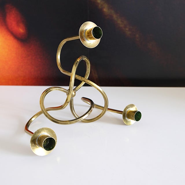 The Knot of Friendship candleholder, designed by Josef Frank for Svenskt Tenn in 1938, is as relevant today as it was...
