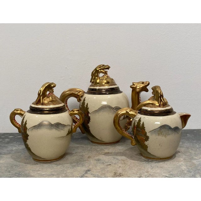 A late 19th Century Japanese 3 piece tea set, circa 1880. The pieces measure Sugar 7" h . x 6.25" w x 4.75" d, Creamer...