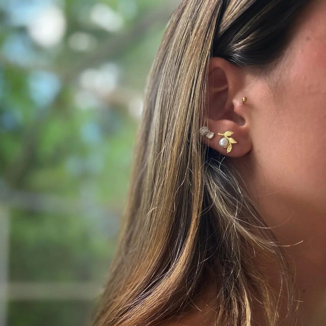 Introducing the captivating Cleopatra Pearl Floral Gold Earrings, a bewitching blend of history, elegance, and modern...
