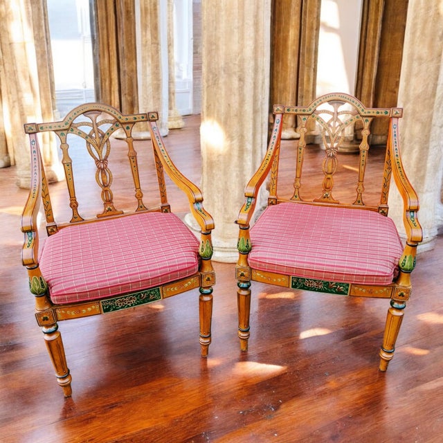 Elevate any living space with this exquisite pair of English Adam style armchairs, a testament to refined taste and...