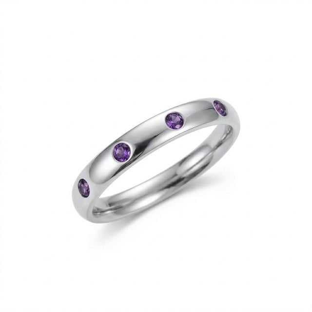 This contemporary band ring features a refined arrangement of Amethyst gemstones, admired for their rich violet hue and...