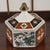 The Vintage Hexagonal Japanese Imari-Style Covered Trinket, Candy Dish is a charming and unique piece of Japanese culture....