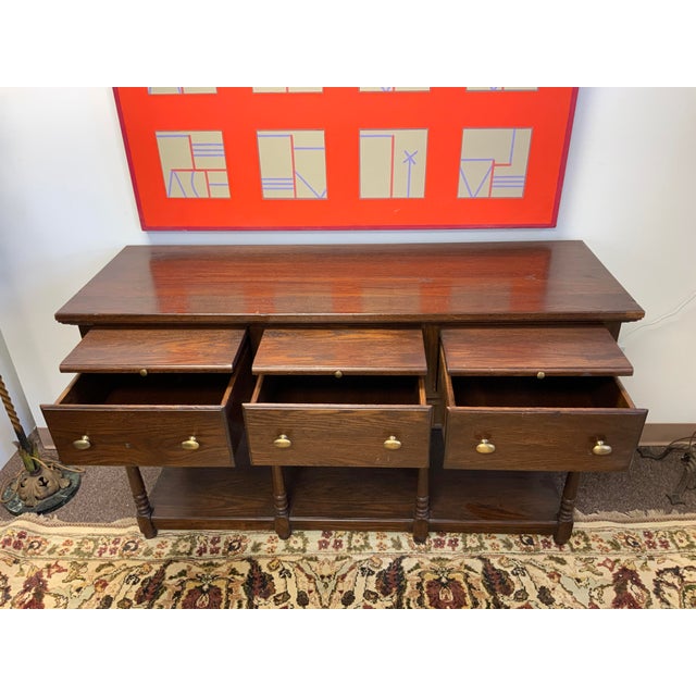 20th Century Stone House collection oak wood console. Drawers, pull out shelves. Open shelf bottom.