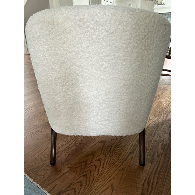 Fabulous mid-century modern arm chair. Vintage - but freshly reupholstered with cream boucle fabric.