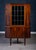 Elegant Danish corner cabinet from the 1960s crafted in richly grained rosewood. Features beautiful leaded dark glass and...