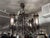 Design Plus Gallery presents an Antique Gothic Wrought Iron Chandelier. This antique chandelier showcases an ornate...