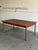 This expansive dining table features a minimalist profile and clean lines. Hidden extensions provide flexible seating...
