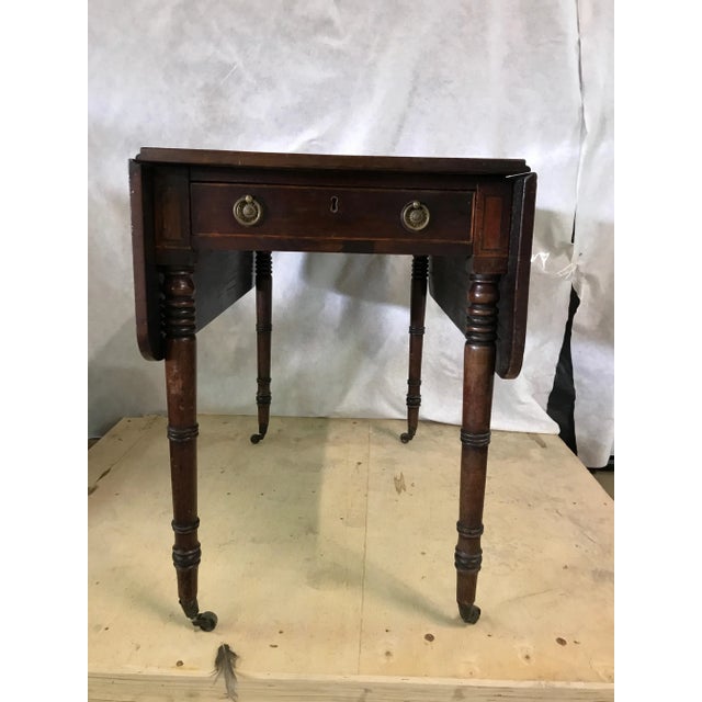 19th century regency mahogany drop leaf table. Great original piece. One drawer with false drawer on back side. Original...