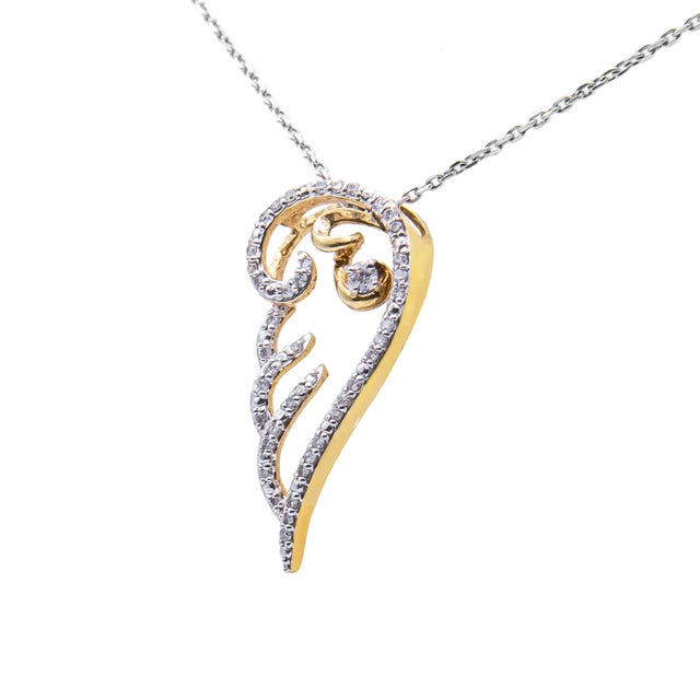 Show off your angelic side with this stunning 10K yellow gold coated .925 sterling silver diamond angel wing pendant. This...