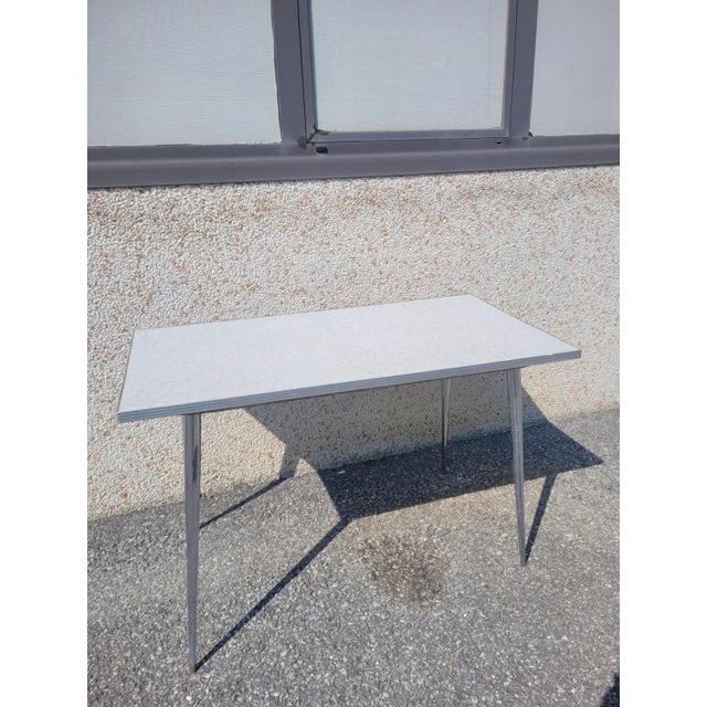 Vintage dining table with metal frame and Formica top. Period: 1960s Good overall condition, with signs of wear. Top...