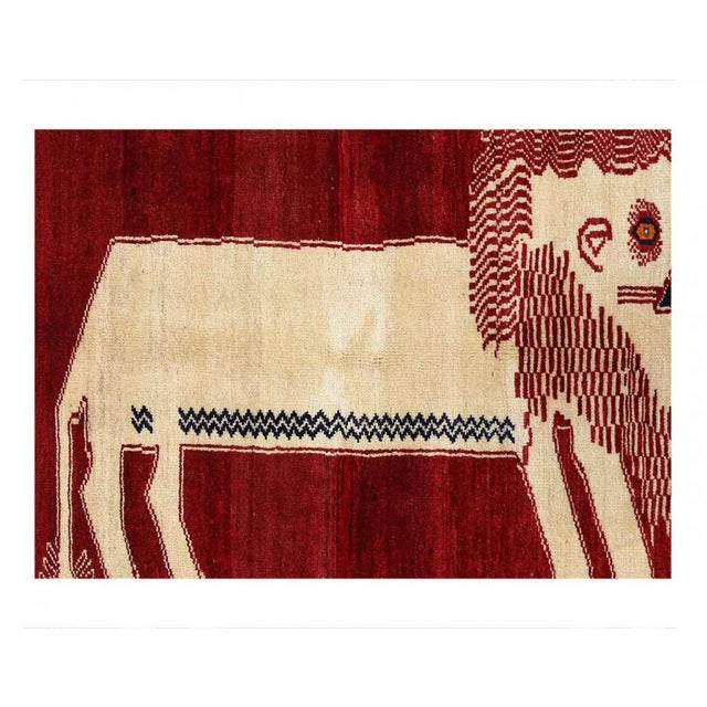 This Shiraz carpet originates from Persia and has been knotted from nomads in a smaller town. Its size is 3'7" by 6'...